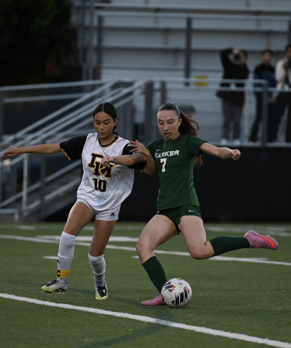 Varsity girls soccer midfielder Kaitlyn Nelson (11) extends her leg to shoot the ball. Kaitlyn made multiple key passes this season, helping the team pull ahead to first in the WBAL League — Skyline Division.