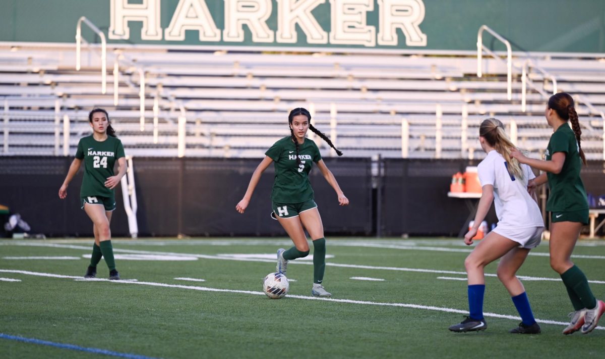 Forward Aanya Sharma (11) dribbles the ball towards an open space. Aanya scored the first goal of the game less than 20 minutes into the first half.