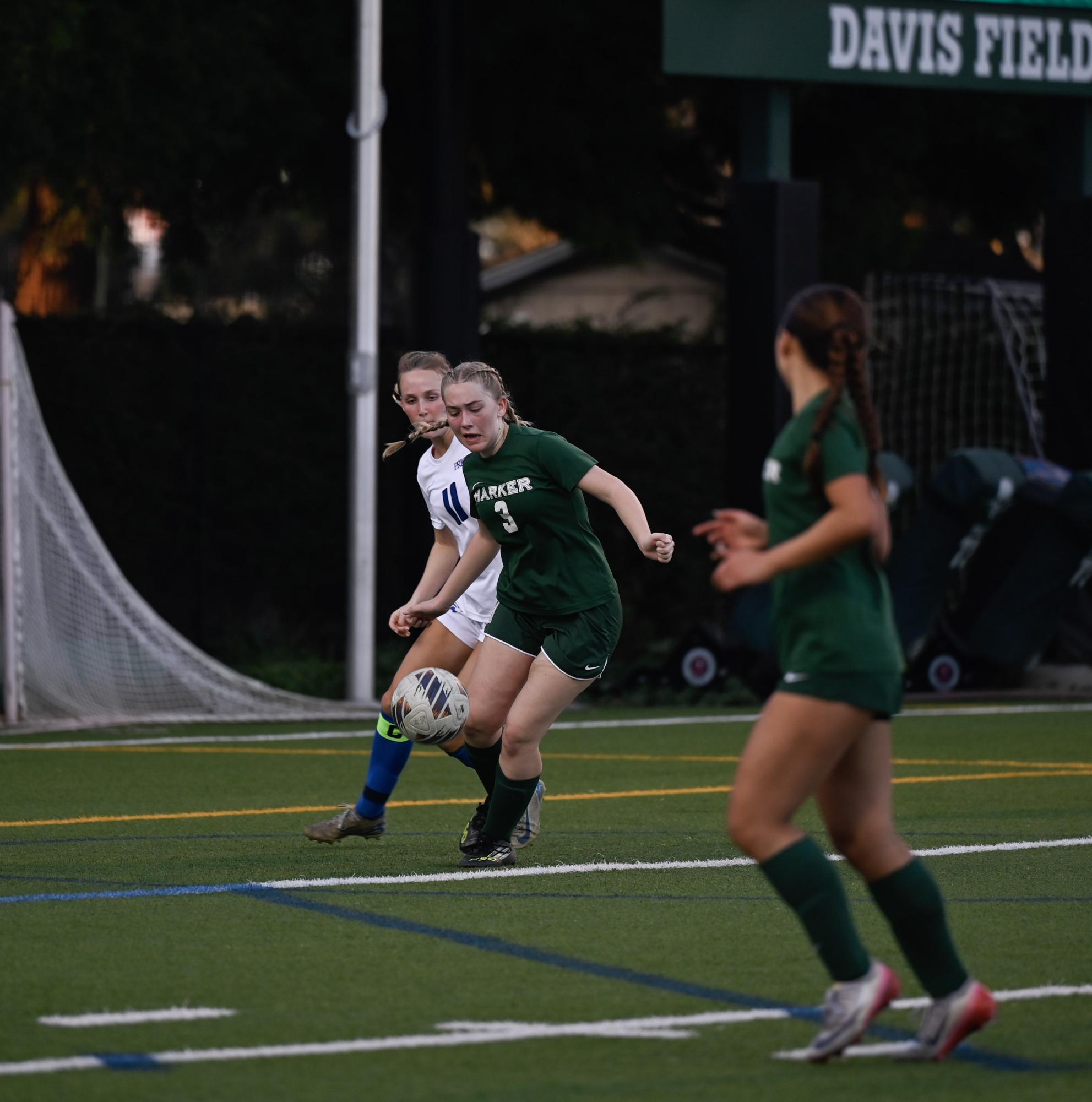Forward Natalie Barth (12) receives a pass. She gave a pep talk during halftime, telling the team to not be discouraged by the physicality of their opponent.