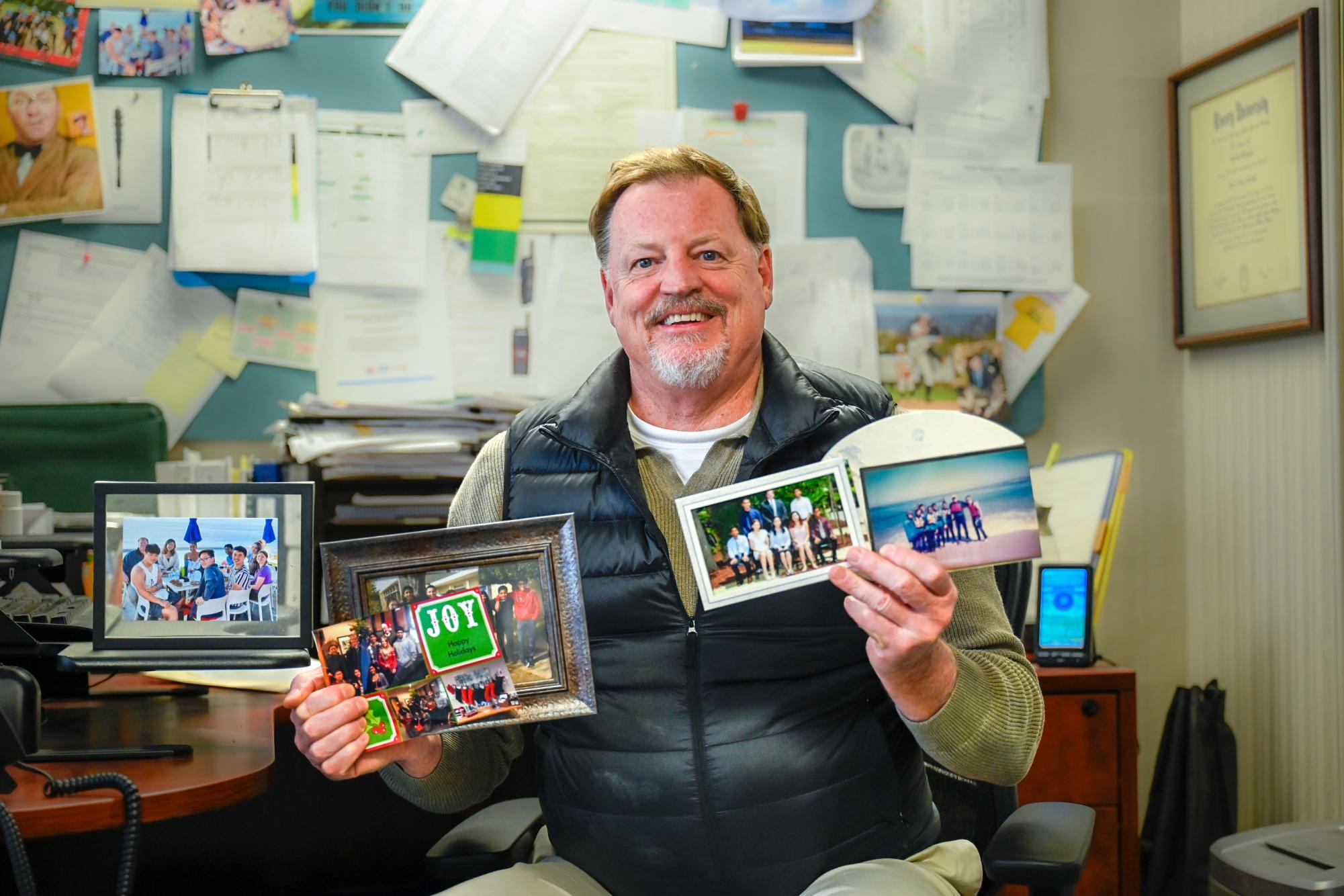 Dean of Students Kevin Williamson shares photos of his five advisory groups across his 26 years at Harker. Williamson drew upon his experiences in boarding school to come up with the advisory program. 