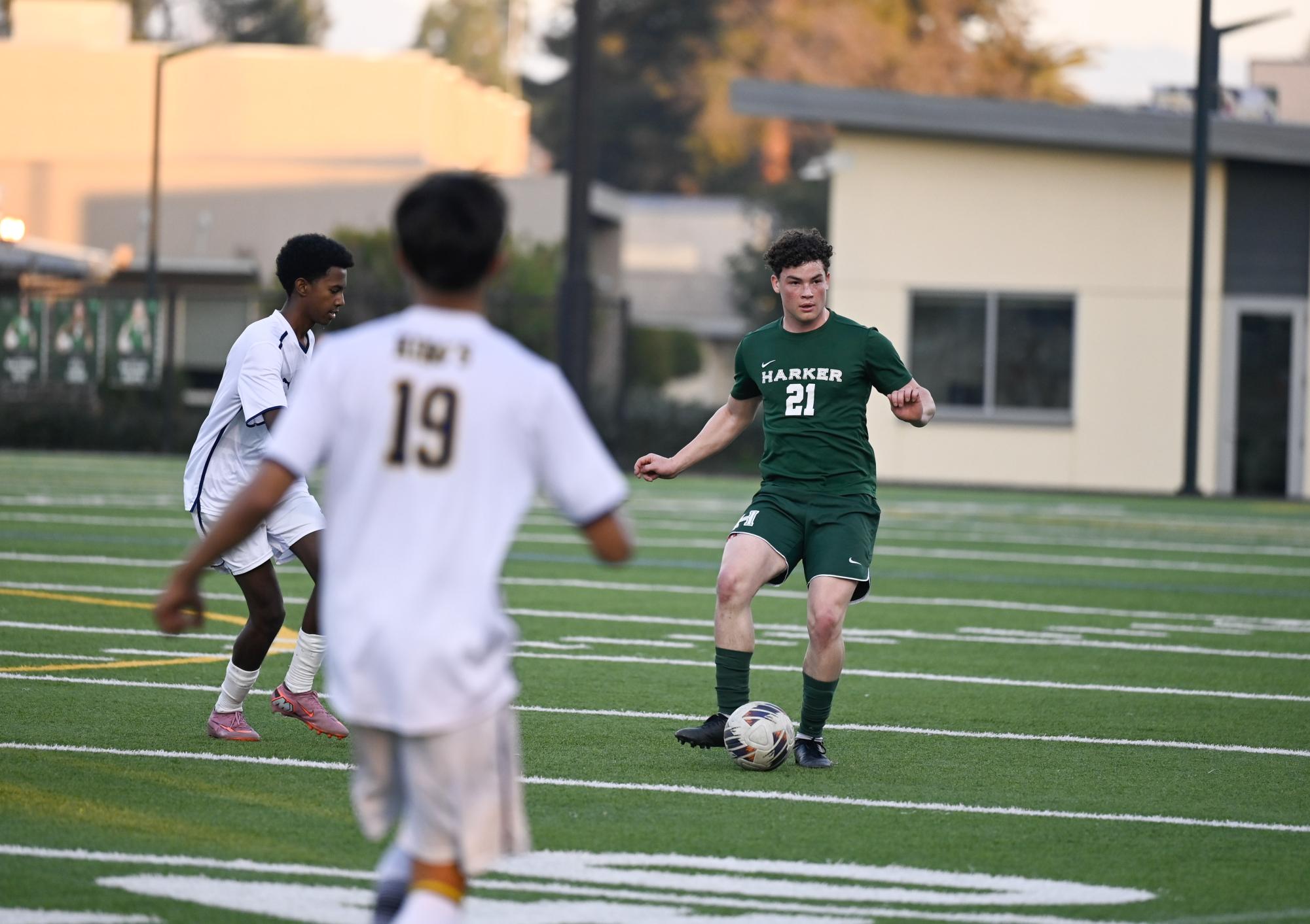 Center back Jackson Powell (12) prepares to pass the ball. He took multiple passes backwards to reset plays.