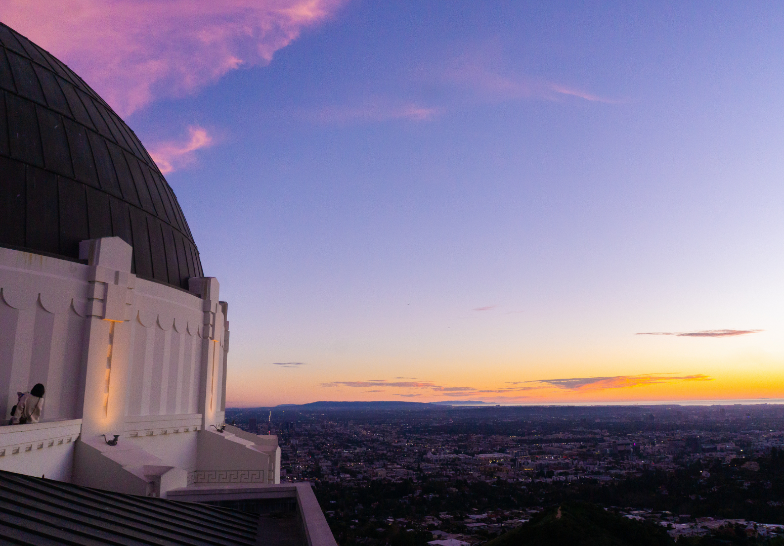  From atop the Griffith Observatory, the sun sets on Los Angeles. Visitors get free admission to look through telescopes and visit exhibits about space.