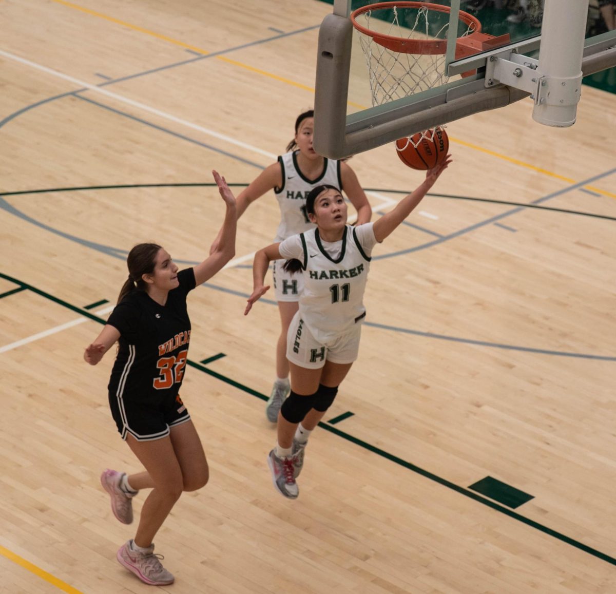 Varsity girls basketball guard Jillian Chen (10) makes a layup attempt. The team powered through league play even with multiple injuries and qualified for CCS championships.