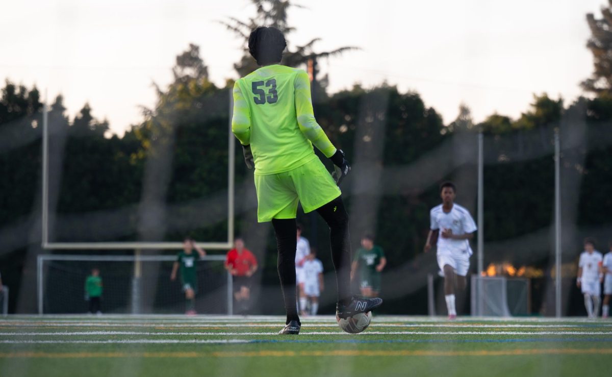 Goalie Mikhil Kiran (12) controls the ball and prepares to build an offensive push. Mikhil notched over half a dozen saves and disruptions, blocking any scoring from King's.