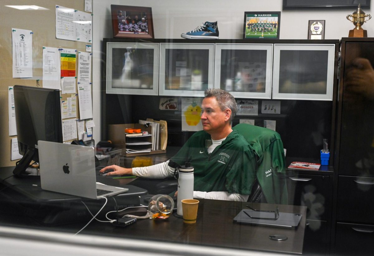 Athletic trainer Wes Howard works on administrative tasks in his office. In addition to treatment, his room is open for athletes to relax. 

