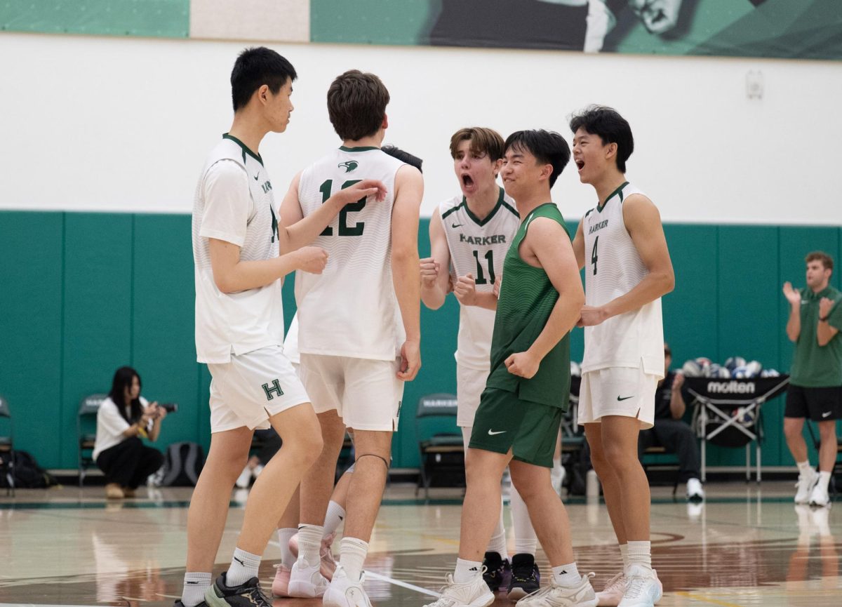 The team celebrates a successful hit from outside hitter Topaz Lee (12). "We only lost by three points there by the end, and if you're going to lose, you want to go down swinging, and that's exactly what we did," head coach Jackson Dupler said. "It's only our second match, and we have a long way to go.”