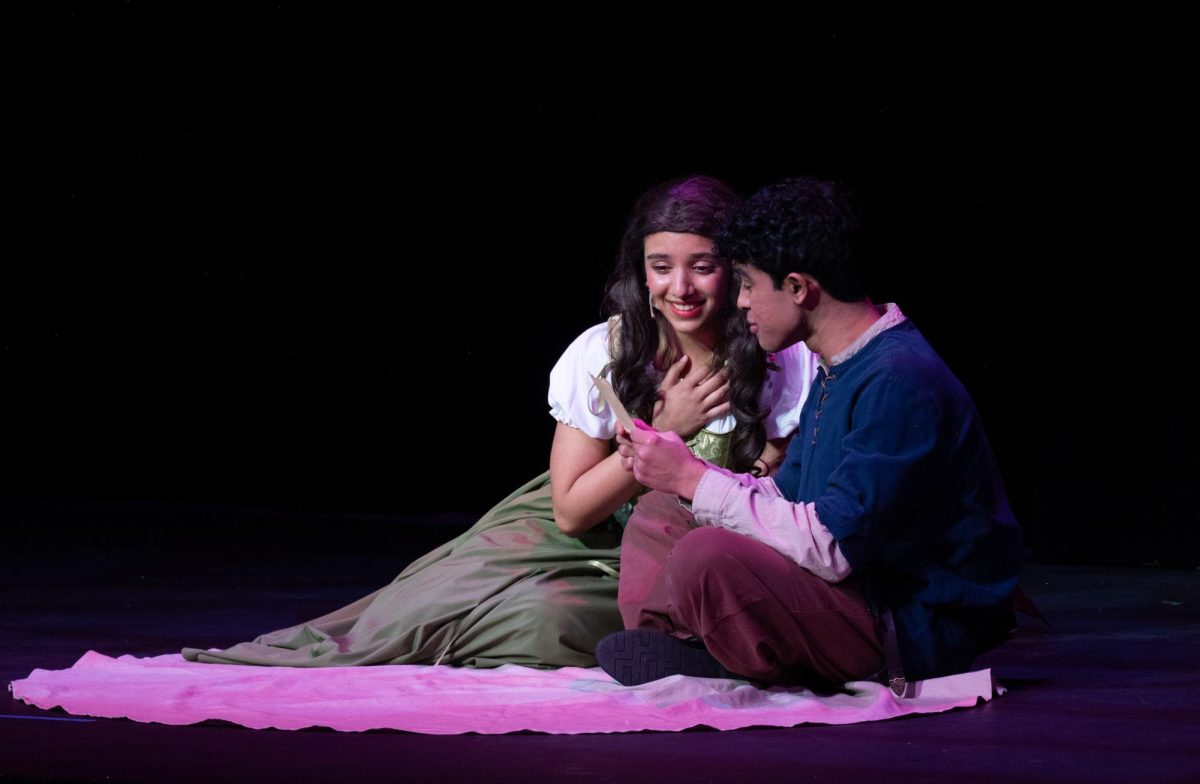 Megha Unny (11) and Aditya Ramanathan (12) sing a ballad together. The two played star-crossed lovers, united over their shared love for theater and poetry.