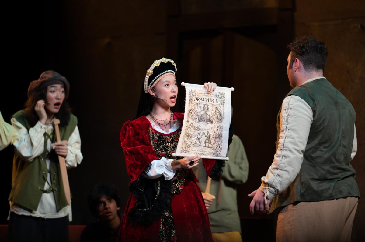 Lord Clapham, played Sophia Zhu (11), warns the theater troupe. Many characters wore elaborate costumes like these.