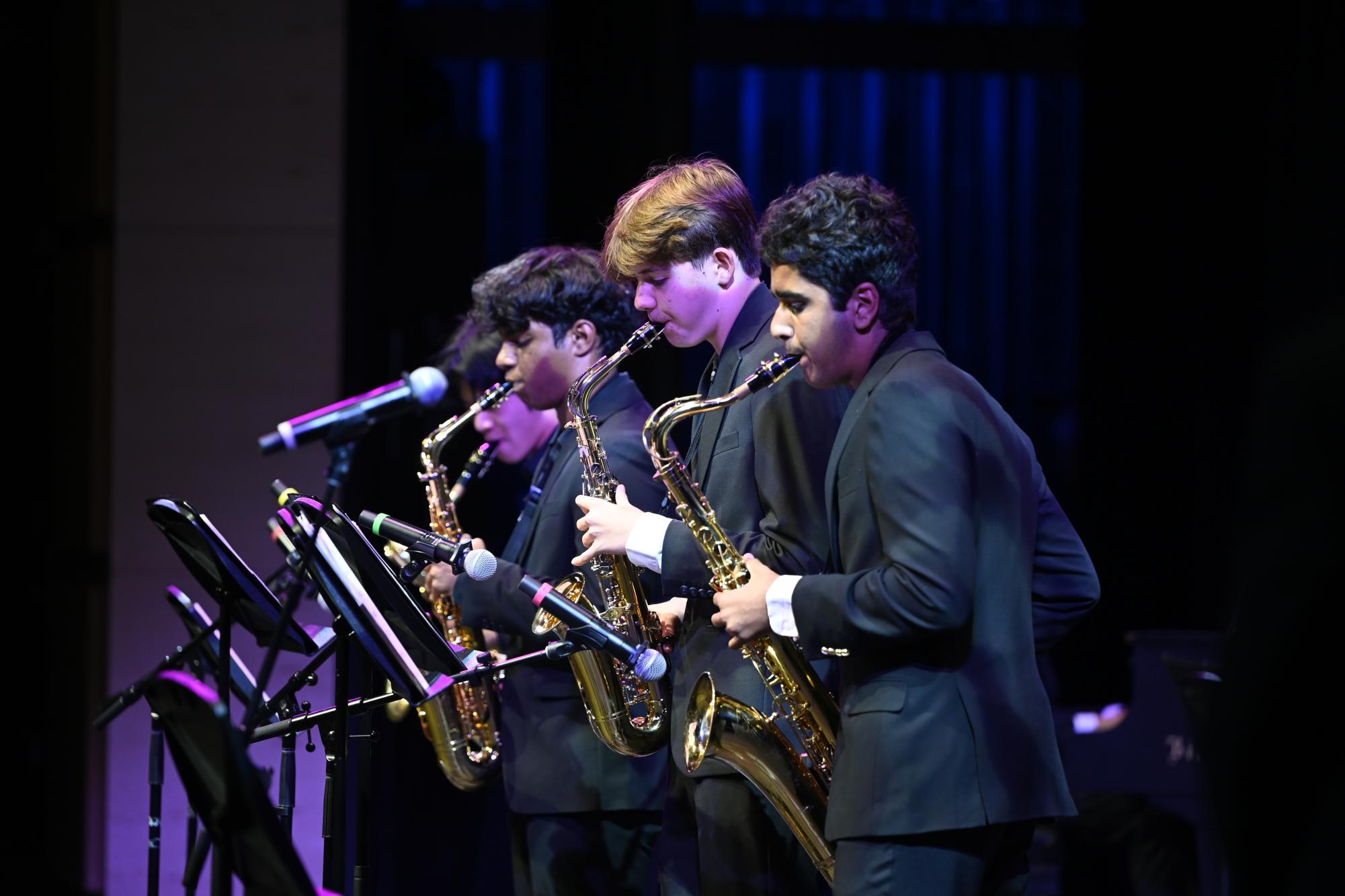 Sophomores Aydin Mesic and Arjun Khara play with two other saxophonists for Lab Band. They opened the show with "Caravan" from "Whiplash."