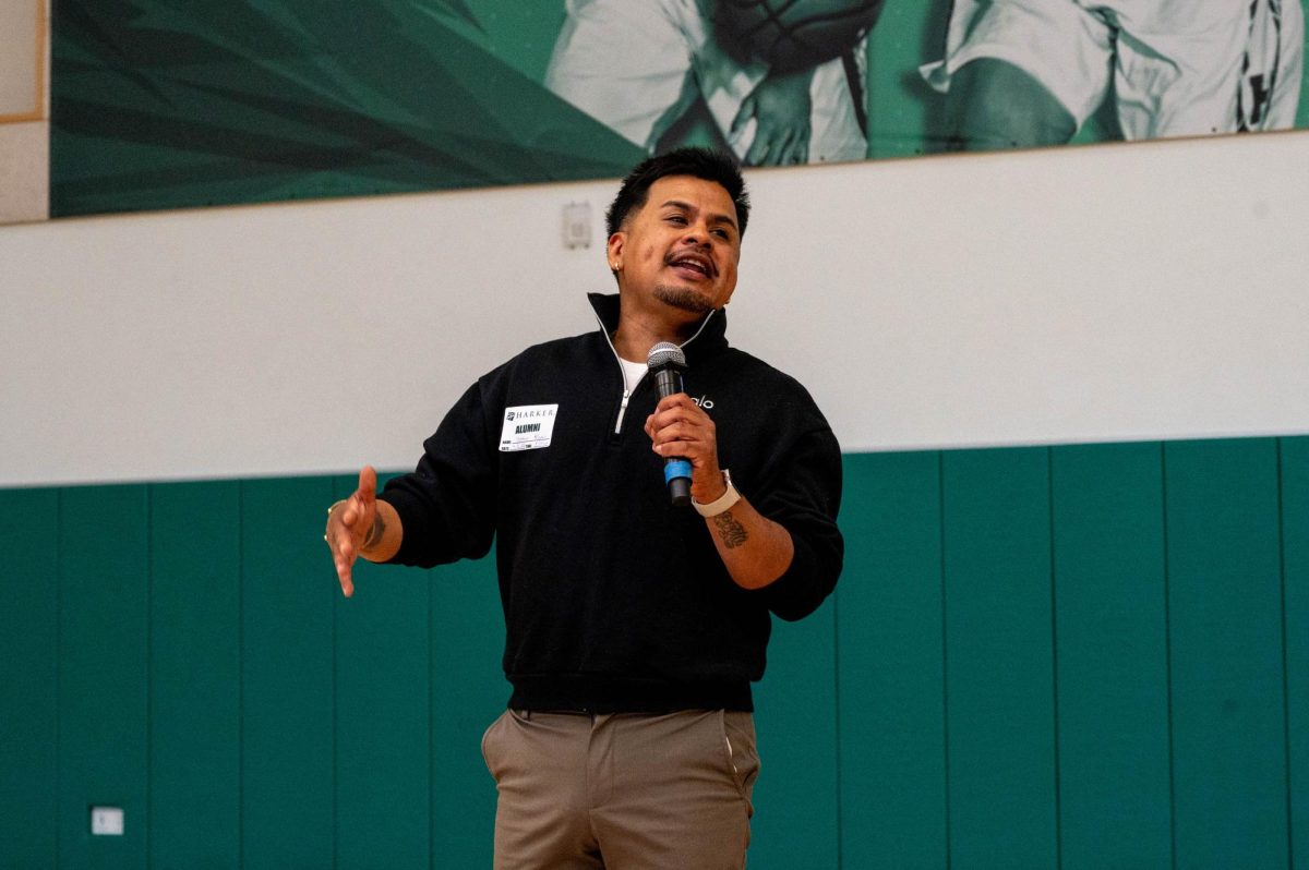 Santa Clara County Poet Laureate and 2024 Creative Ambassador of San Jose City Yosimar Reyes gestures as he shares his poem "Yo Soy." After school meeting, he led a poetry session in the multi-purpose room where students were invited to ask questions.