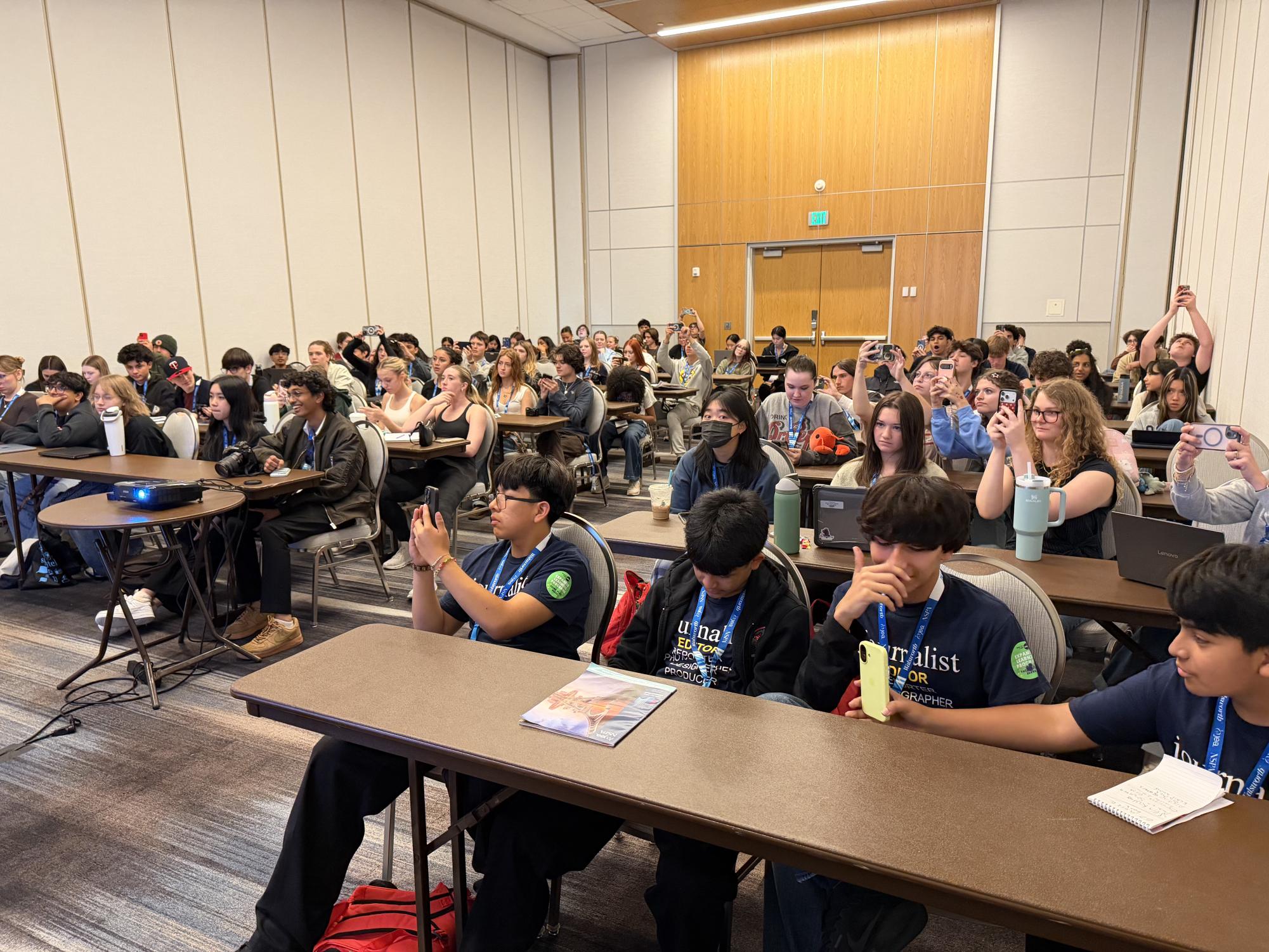 Attendees of the "67 Ways to Bond" session fill the room. The audience was encouraged to take photos and ask questions throughout the presentation.
