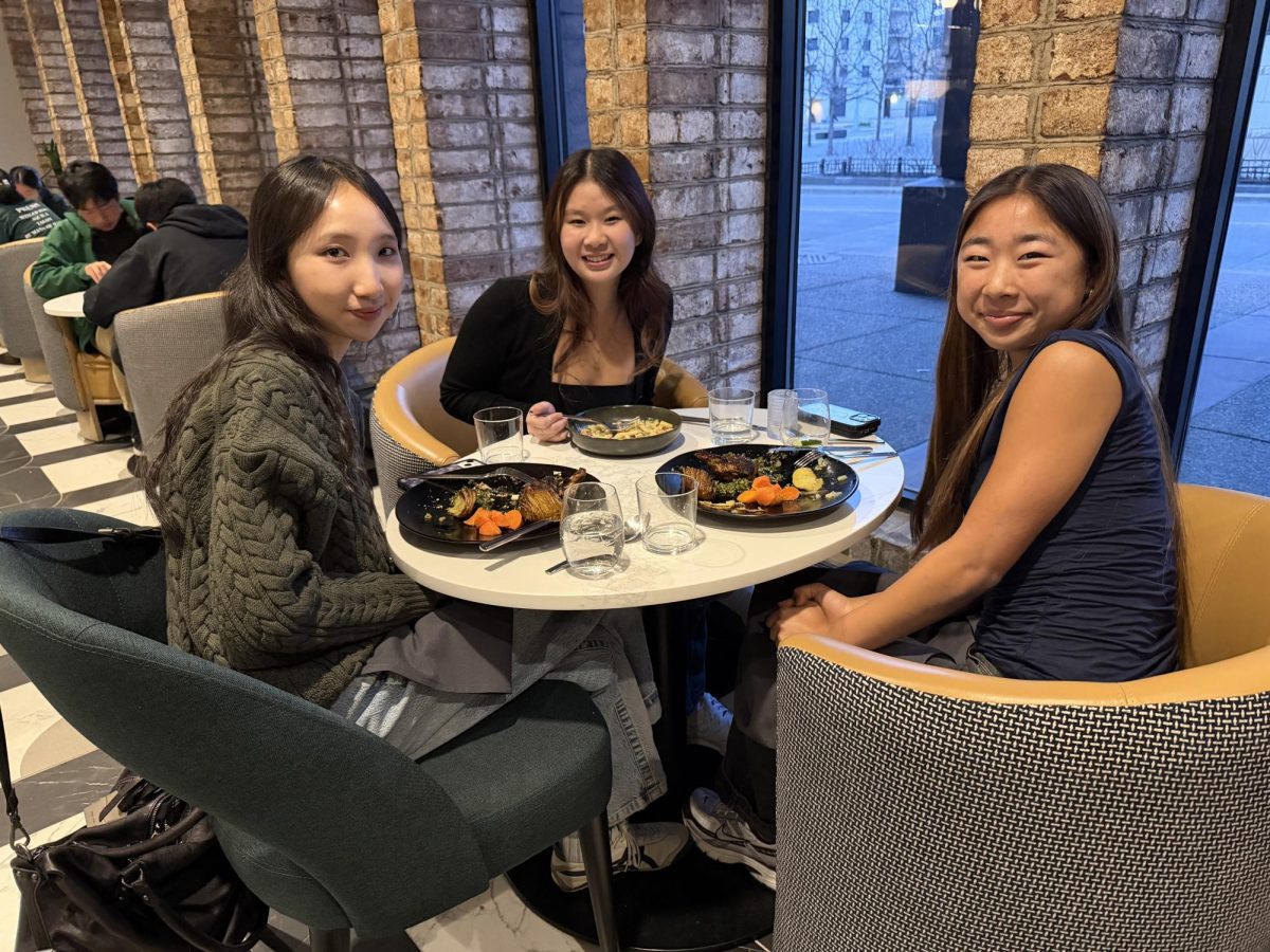Former senior Harker Aquila Editors-in-Chief Lily Shi, Eva Cheng and former senior Winged Post Editor-In-Chief Tiffany Zhu pose with their dinner. Esther's Table had many seating areas for groups of friends to converse while dining.