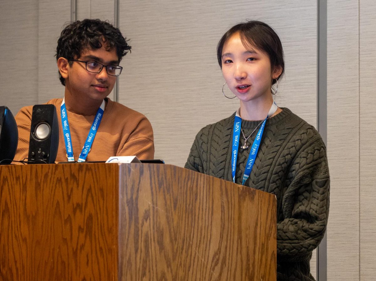 Opinions editor Shreyas Karnam (10) and former Aquila Editor-in-Chief Lily Shi (12) present "Celebrate the Silver Lining." The presentation explored how to navigate and learn from challenges, from covering controversial topics to covering losses by sports teams. 