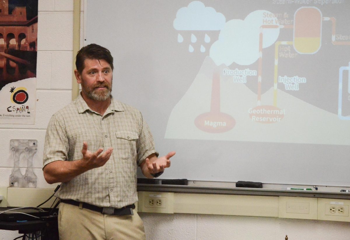 Chemistry teacher Andrew Irvine explains how a geothermal power plant operates. He described how power plants send steam to turbines, which then generate electricity with little environmental impact.
