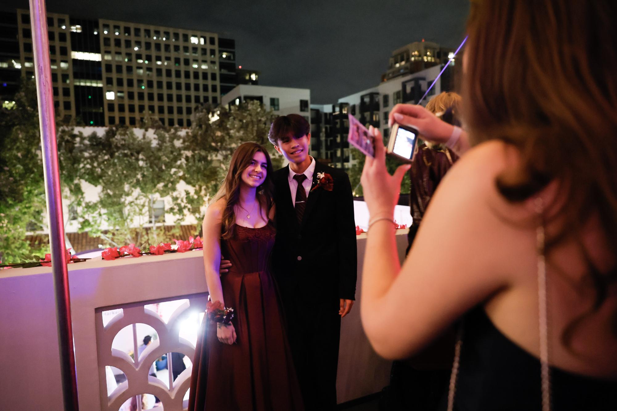 Seniors Emily Bryan and Timmy Chen smile for a picture on the third floor of the venue. On this floor, students also had the option to play gambling games and eat small snacks.