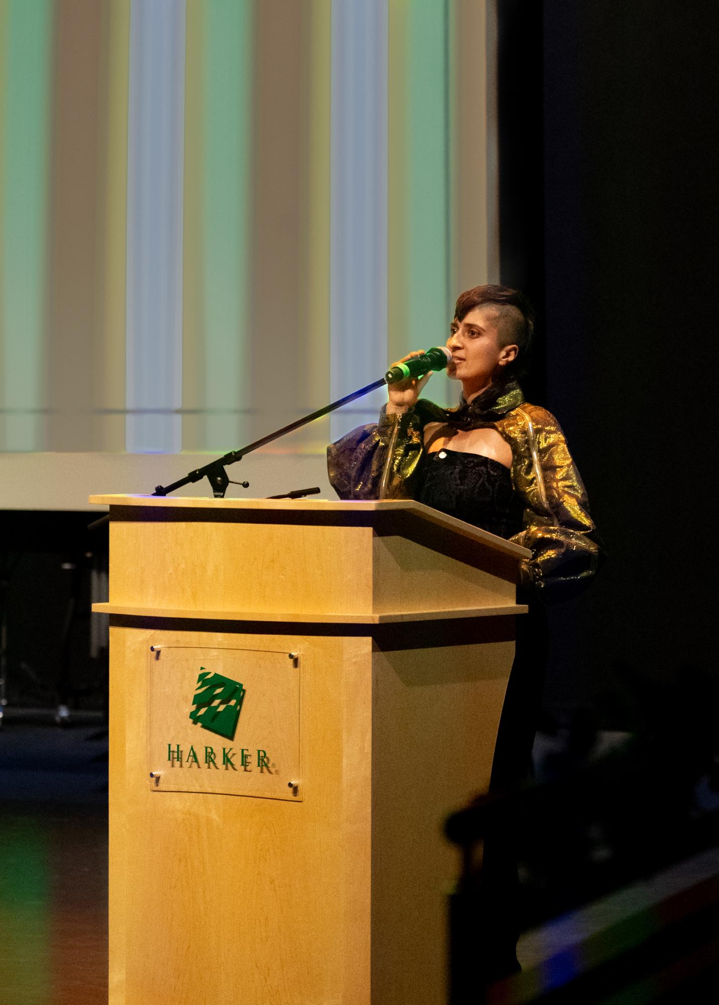 Ankita Sharma ('06) speaks to the audience while accepting their "Life in the Arts" award. "In some ways it feels like there's a Harker lineage of people who graduate and that's very sweet to be a part of," Sharma said.