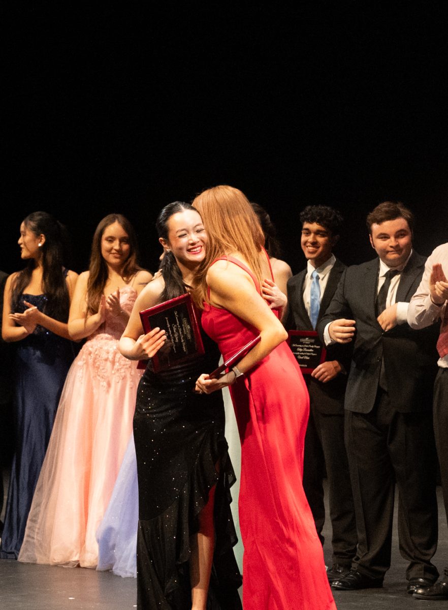 Senior Certificate dancer Selina Wang embraces her mentor dance teacher Rachelle Haun. At the end of the night, performing arts teachers presented plaques to each of the Certificate members to honor their completion of the program.