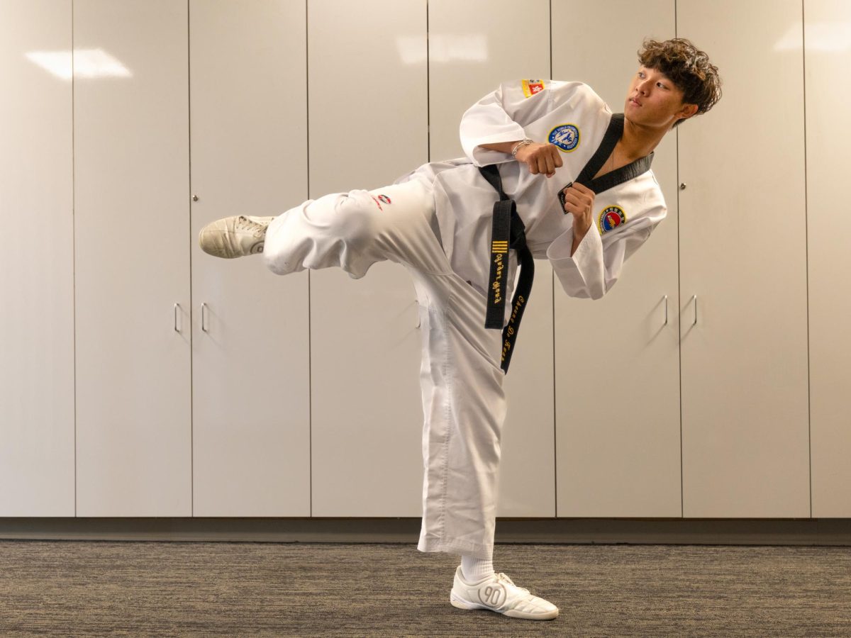 Sophomore Angus Wang chambers his leg, ready to unleash a side kick. “My style of form in taekwondo is really powerful,” Angus said. “It’s about striking and getting close, going for the hits rather than small points.”
