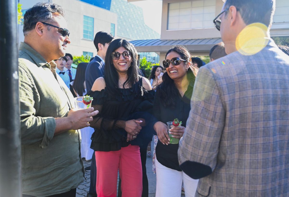 Parents enjoy drinks as they mingle after their children laid down their bricks. This year, 116 seniors received bricks, since their families donated at least $2,026 to the school.