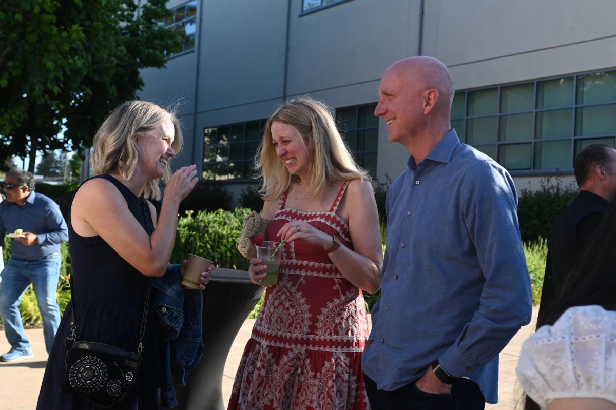 Parents chat amongst themselves as they celebrate their children's incoming graduation. The bricklaying tradition was meant to honor the legacy of the graduating class.