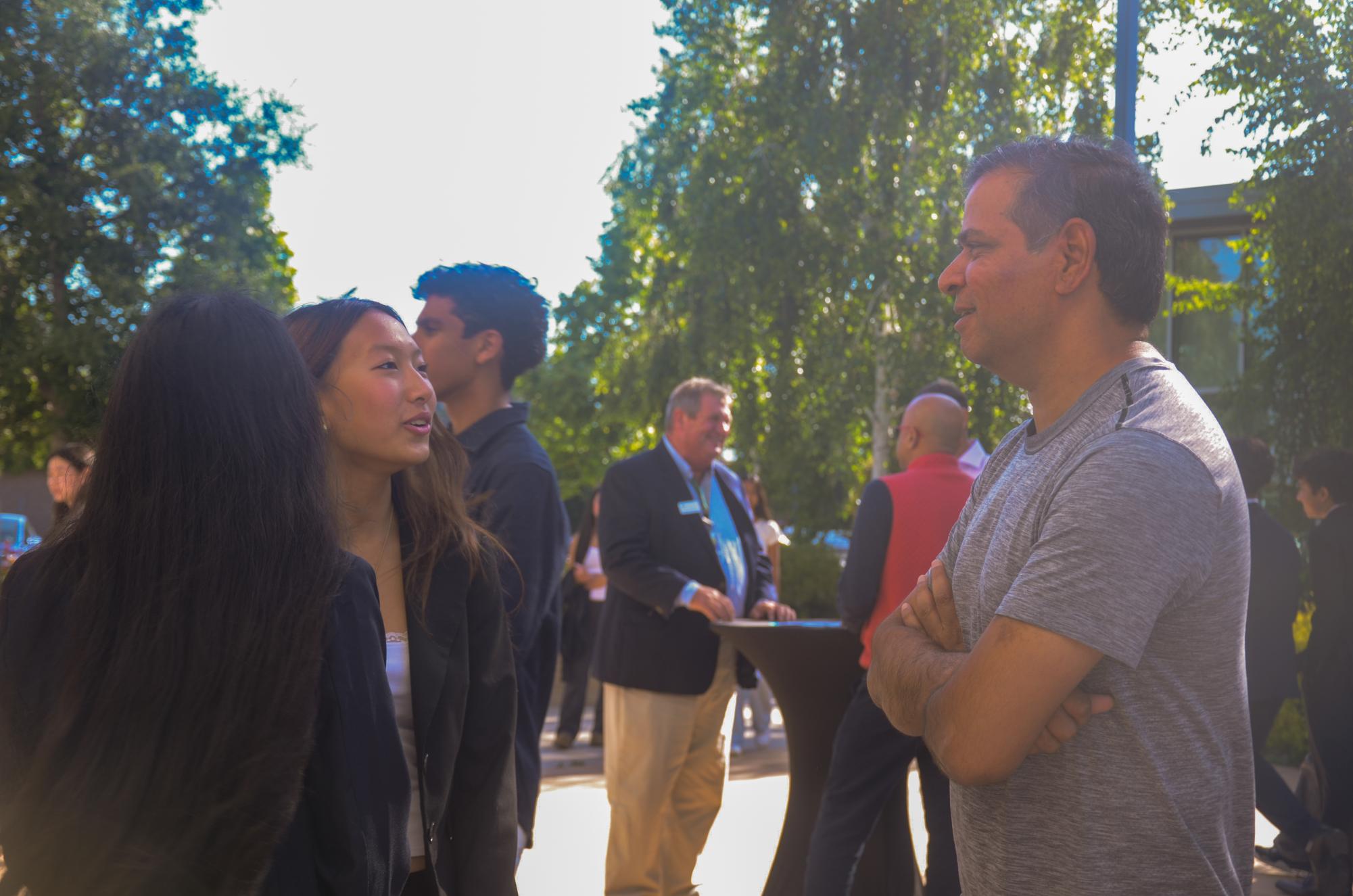 Business and Economics students speak with parents and faculty members before the start of the annual B&E banquet Friday in the RPAC courtyard. Attendees had the opportunity to network and learn more about student-led programs, clubs and startups before presentations began.