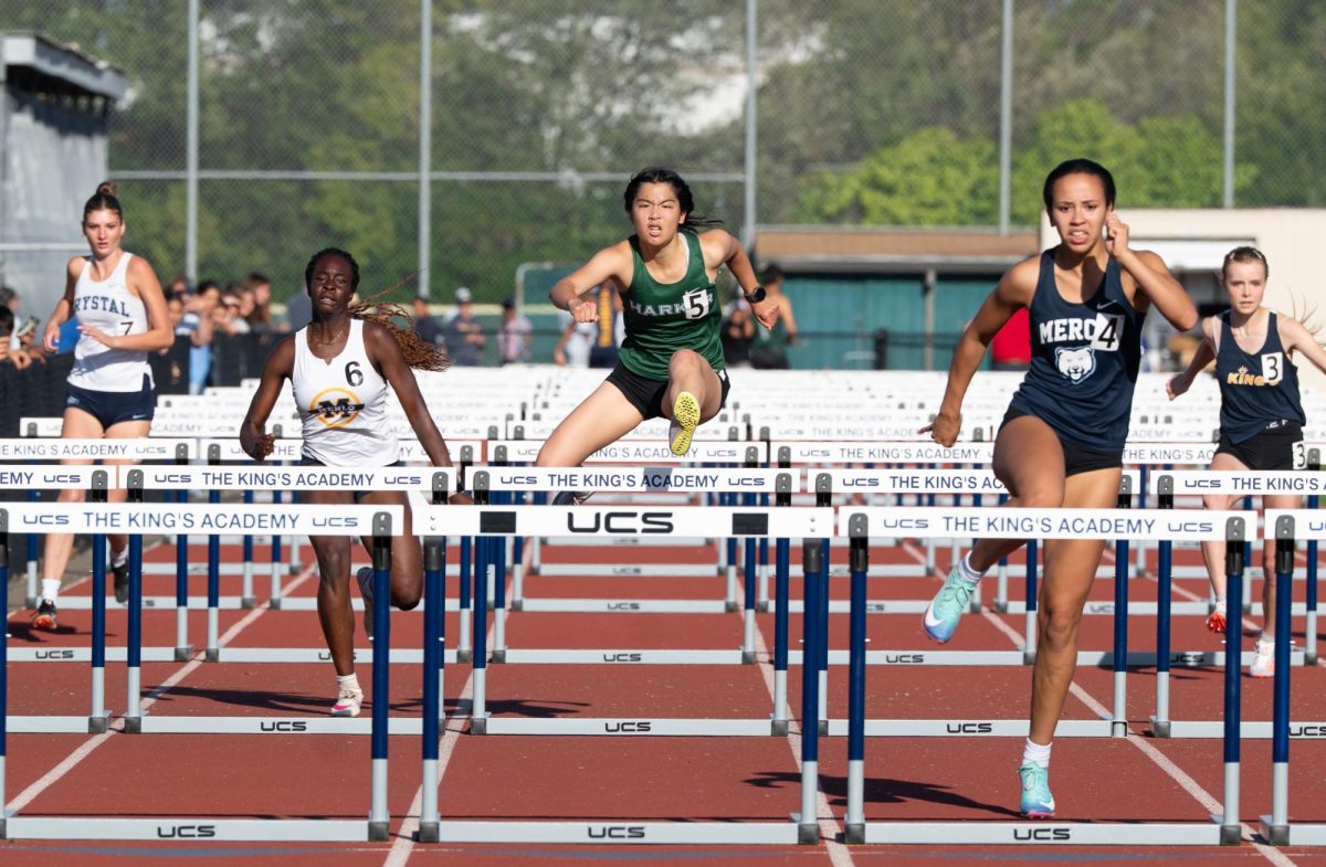 Varsity girls sprinter Alice Luo (11) competes in the 100 meter hurdles at WBAL finals at Kings Academy on May 8. She placed second with a time of 17.36.