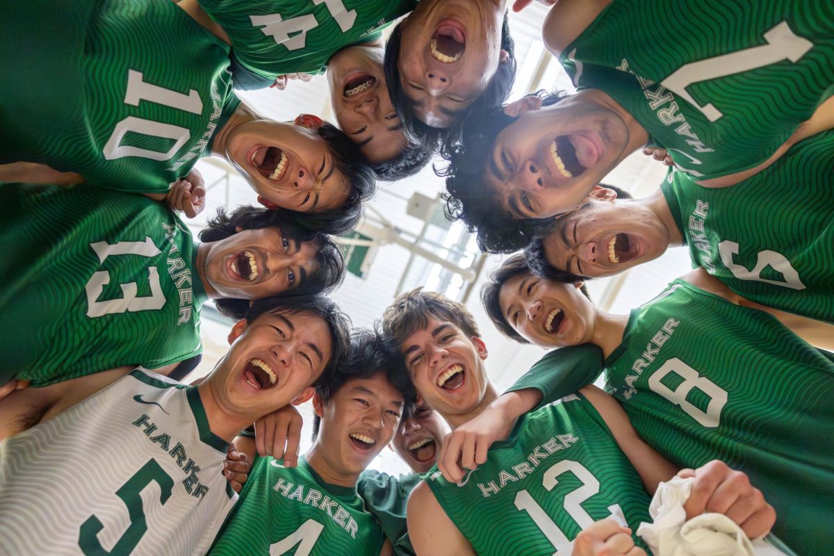 The varsity boys volleyball team gathers together before their game against Monta Vista on April 24. They had a tradition of saying a loud chant before each game this season.