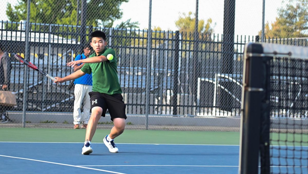 Doubles player Evan Zhang (‘26) prepares to hit a ball in his first game against Sacred Heart. Evan remained steady on the defensive end of the ball to help his partner Yash Sachdeva (11) and the team’s success over the course of the season.